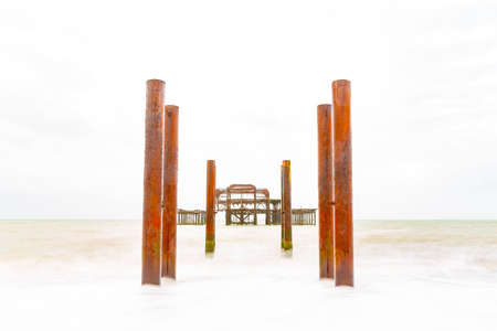 HIGH KEY Deliberately Over Exposed Atmospheric and Moody Long Exposure Photograph of the Ruins of the old Brighton West Pier at Brighton, East Sussex, England, UK.の写真素材