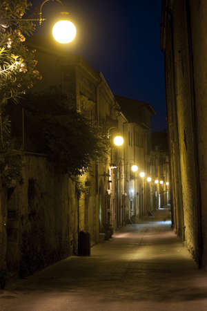Old street in Arezzo (Tuscany, Italy) at nightの写真素材