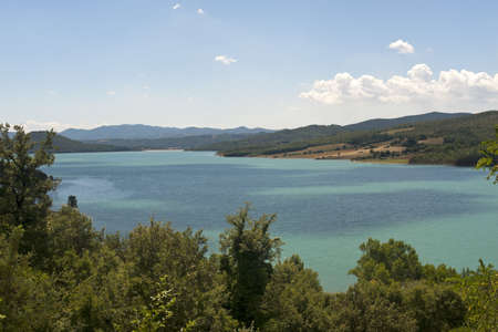 Landscape with lake near Arezzo (Tuscany, Italy) at summerの写真素材