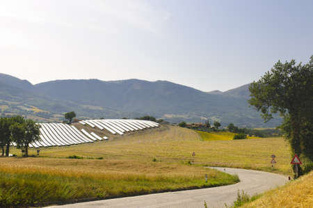 Landscape in Marches (Italy) with solar panels at summer