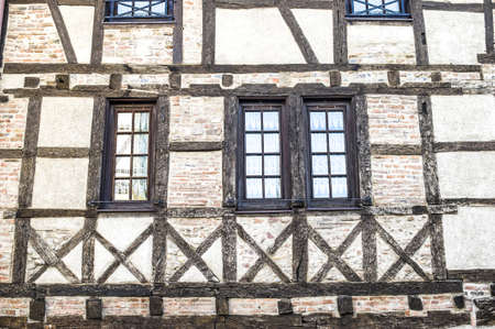 Chalamont (Ain, Rhone-Alpes, France) - Windows of a half-timbered houseの写真素材