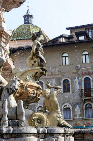 Historic fountain in the cathedral square of Trento (Trentino Alto Adige, Italy)の写真素材