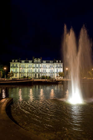 Ancient palace in Verdun (Meuse, Lorraine, France) on the river at nightのeditorial素材
