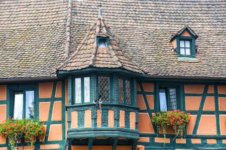 Scherwiller (Bas-Rhin, Alsace, France) Exterior of old half-timbered house with flowersの写真素材