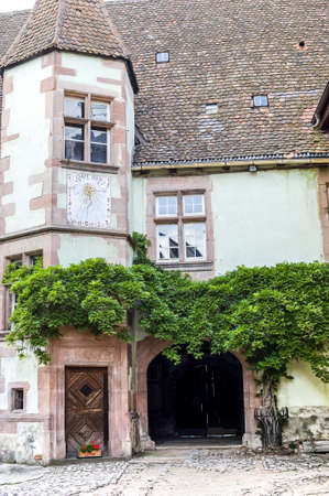 Riquewihr (Bas-Rhin, Alsace, France) - Exterior of old house with towerの写真素材