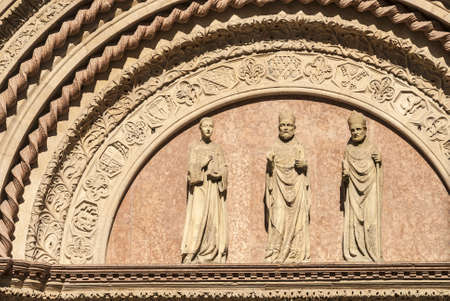 Perugia (Umbria, Italy) - Lunette with statues and pink marble background on a historic palaceの写真素材