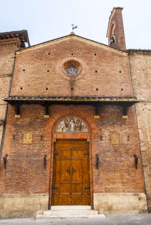Siena (Tuscany, Italy) - Ancient church, facade with lunetteの写真素材