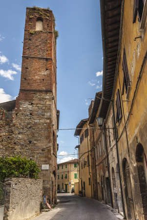 Vicopisano (Pisa, Tuscany, Italy) - Tall medieval tower and a street of the ancient townの写真素材