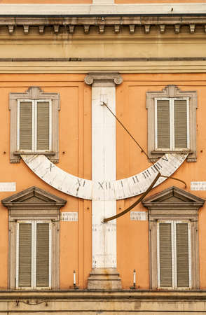 Piacenza (Emilia-Romagna, Italy) - Ancient palace facade: sundial