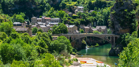 Gorges du Tarn (Lozere, Linguedoc-Roussillon, France), famous canyon at summer. Village, bridge and canoesの写真素材