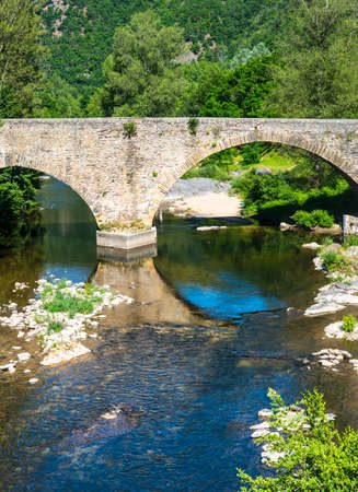 Parc des Cevennes (Gard, Languedoc-Roussillon, France): old bridge over a riverの写真素材