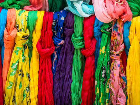 Pezenas (Herault, Languedoc-Roussillon, France), medieval city: colorful foulards at a outdoor shop