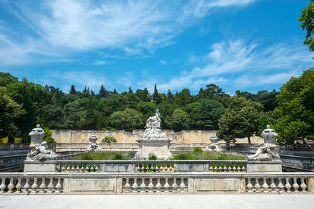 Nimes (Gard, Languedoc-Roussillon, France), statues and fountain in the parkの写真素材
