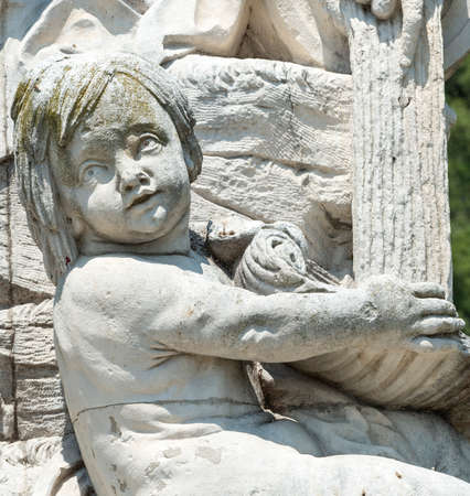 Nimes (Gard, Languedoc-Roussillon, France), statues and fountain in the parkの写真素材