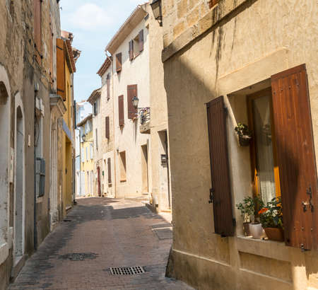 Istres (Bouches-du-Rhone, Provence-Alpes-Cote d'Azur, France), a typical old streetの写真素材