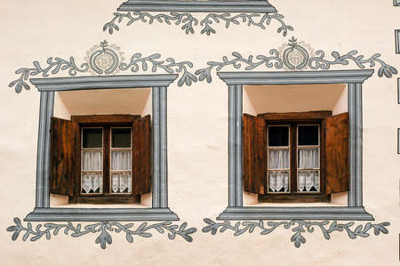 Bergun / Bravuogn (Graubunden, Switzerland), typical old house, wooden windowsの写真素材