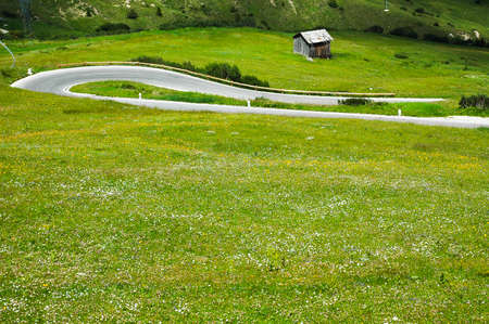 Passo Pordoi (Dolomites, Belluno, Veneto, Italy), mountain landscape at summer:the winding roadのeditorial素材