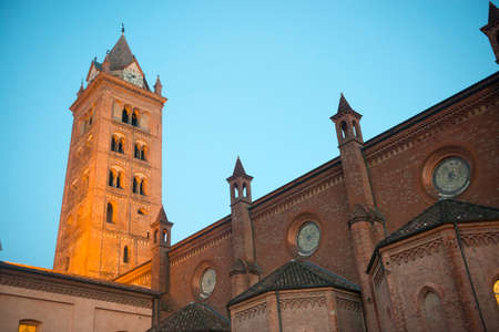 Alba (Cuneo, Piedmont, Italy): belfry of the cathedral at eveningの写真素材