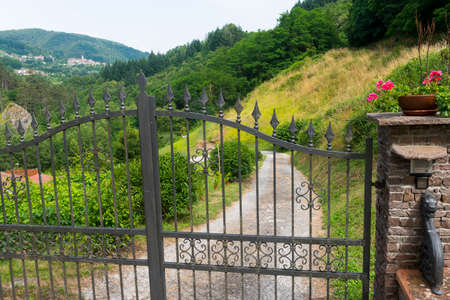 Garfagnana (Lucca, Tuscany, Italy): gate and potted flowersの写真素材