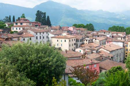 Barga (Lucca, Tuscany, Italy): buildings and garden in the historic town in Garfagnanaの写真素材