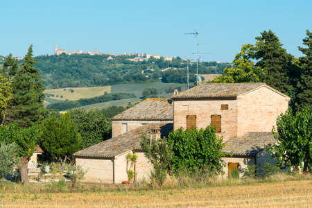 Landscape near Macerata (Marches, Italy) at summer: old house