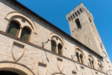 Montelupone (Macerata, Marches, Italy), medieval village at summer. Palace with towerの写真素材