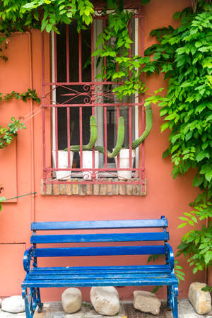 Santarcangelo di Romagna (Rimini, Emilia-Romagna, Italy): typical house with potted plants and a blue benchのeditorial素材