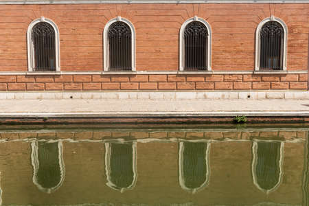 Comacchio (Ferrara, Emilia-Romagna, Italy): the typical city with its canalsの写真素材