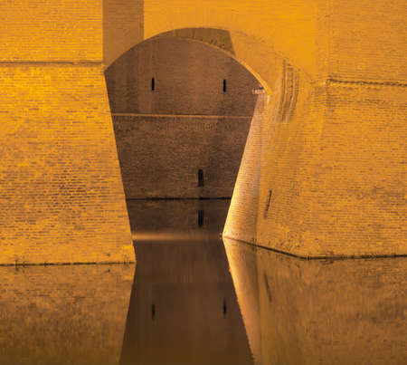 Ferrara (Emilia-Romagna, Italy): facade of the medieval castle at eveningのeditorial素材