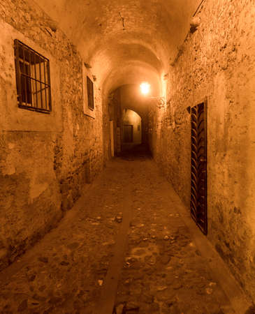 Aulla (Massa e Carrara, Tuscany, Italy), historic town in Lunigiana. Covered alley at eveningのeditorial素材