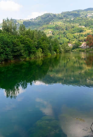 The Serchio river (Lucca, Tuscany, Italy) in a sunny summer morningの写真素材