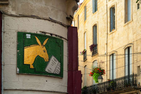 Montpellier (Languedoc-Roussillon, France): facade of historic palaces and hanged potted plants and flowersの写真素材