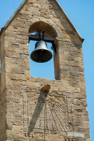 Salon-de-Provence (Bouches-du-Rhone, Provence-Alpes-Cote-d'Azur, France): facade of historic church: bell and sundialの写真素材