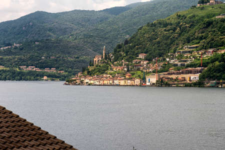 The Ceresio Lake (Ticino, Switzerland)), landscape at summer. Church of Santa Maria del Sassoの写真素材