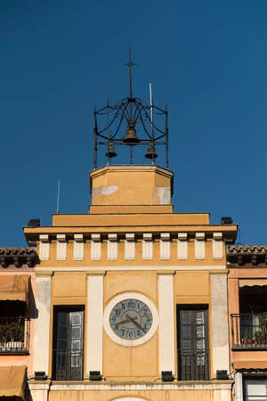 Toledo (Castilla-La Mancha, Spain): facade of historic palace in the Zocodover square, with clock and bellsのeditorial素材