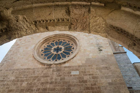 Tarragona (Catalunya, Spain): exterior of the gothic cathedral seen through an arch of another...