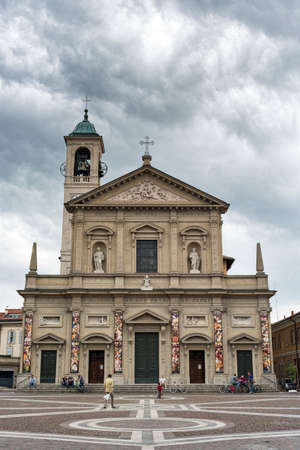 Saronno (Varese, Lombardy, Italy): church of Saints Peter and Paul, built in 1783, in LibertÃ  square, with peopleのeditorial素材