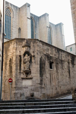 Girona (Gerona, Catalunya, Spain): old typical street and the cathedral in gothic styleの写真素材