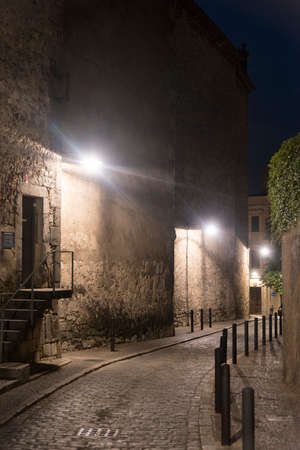 Girona (Gerona, Catalunya, Spain): old typical street by nightの写真素材