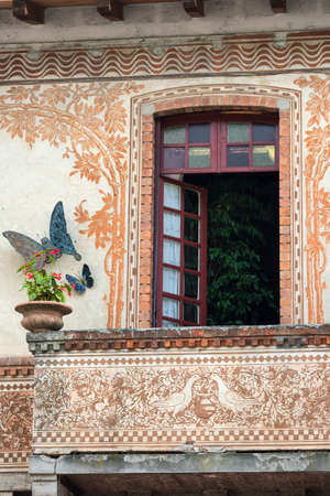 Window of historic house in Porto Ceresio (Varese, Lombardy, Italy), along the Lake of Lugano (Ceresio)の写真素材