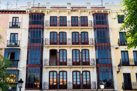 Toledo (Castilla-La Mancha, Spain): facade of historic building with balconies and verandas in the Zocodover squareのeditorial素材