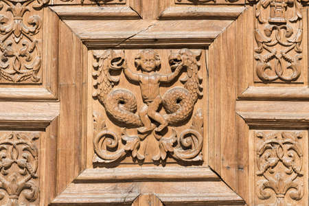 Leon (Castilla y Leon, Spain): exterior of the medieval cathedral, in gothic style: facade, a wooden doorの写真素材