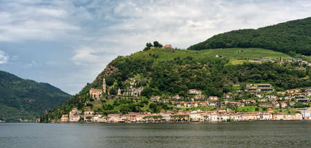 The Ceresio Lake (Ticino, Switzerland)), landscape at summer. Church of Santa Maria del Sassoの写真素材