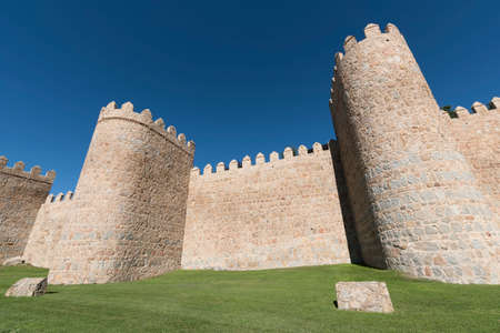 Avila (Castilla y Leon, Spain): the famous medieval walls surrounding the cityの写真素材