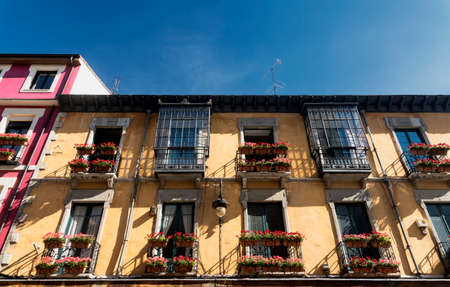 Leon (Castilla y Leon, Spain): historic building in Calle San Pedro with balconies and flowersの写真素材