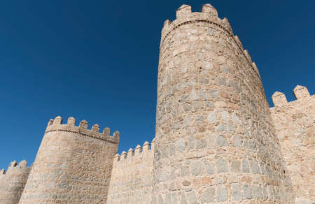 Avila (Castilla y Leon, Spain): the famous medieval walls surrounding the cityの写真素材