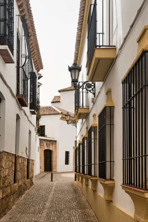 Ronda (Andalucia, Spain): old typical street with white housesの写真素材