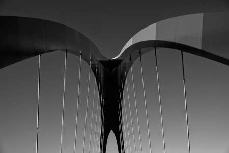 Milan (Lombardy, Italy): modern bridge for pedestrians and bicycles in the Portello area. Black and...