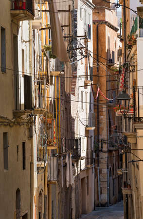 Tarragona (Catalunya, Spain): old street in the gothic quarter, near the medieval cathedralの写真素材