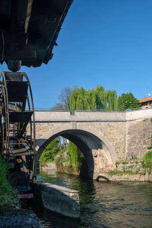 Groppello (Milan, Lombardy, Italy): the big wooden wheel on the Martesana canal known as Rudun and...